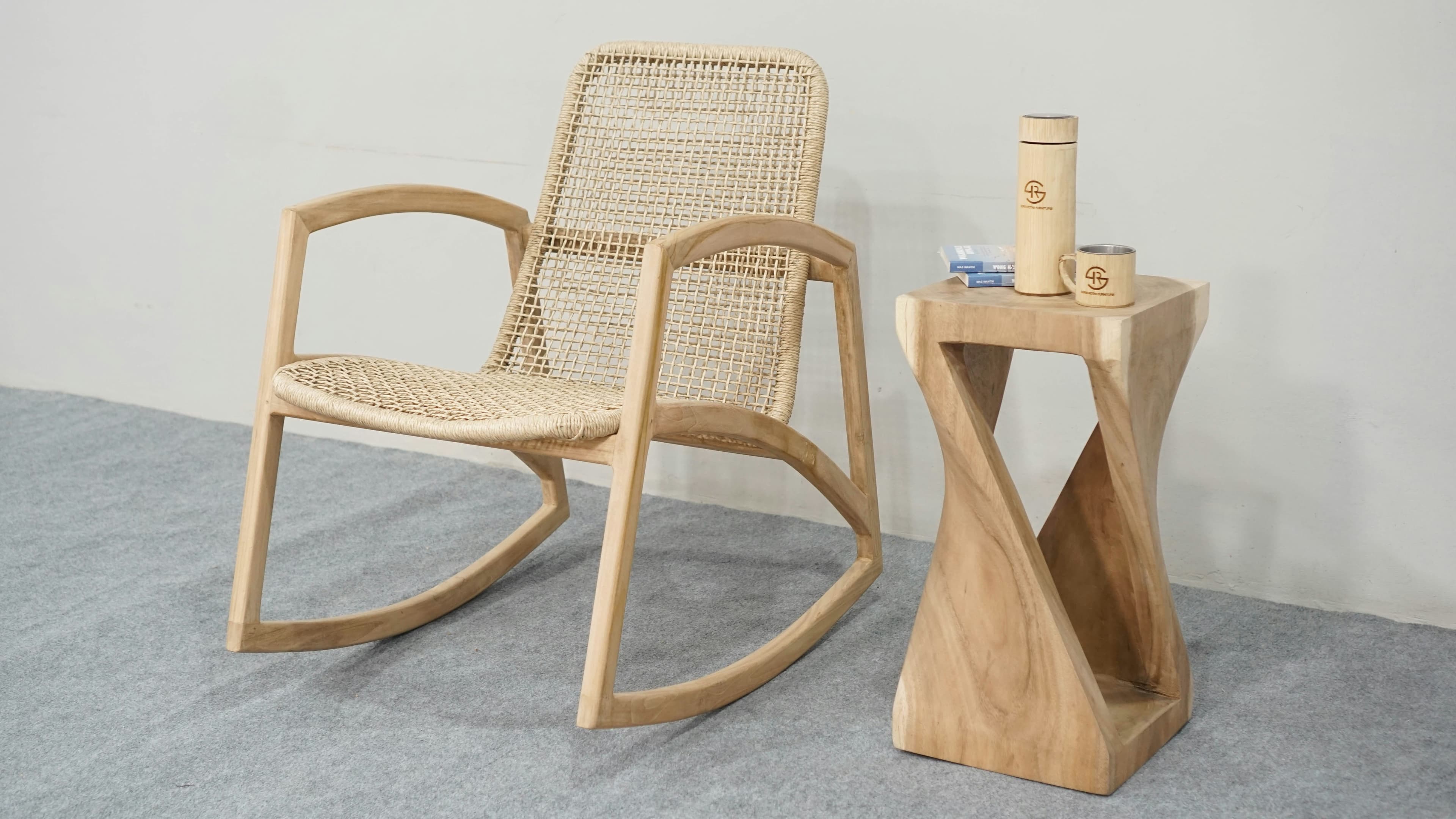 A finished wooden chair and side table with distinctive curves and natural grain